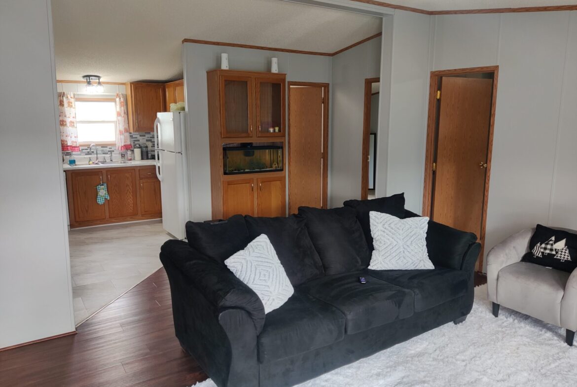 Living room of double wide manufactured home for sale in Pontiac | Buy a Michigan mobile home