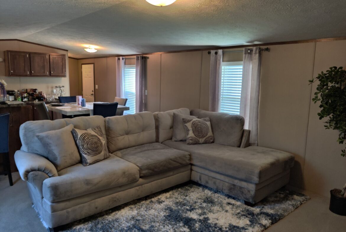 Living room of single wide manufactured home for sale in River's Edge, Clinton Township | Used Mobile Home for Sale Michigan