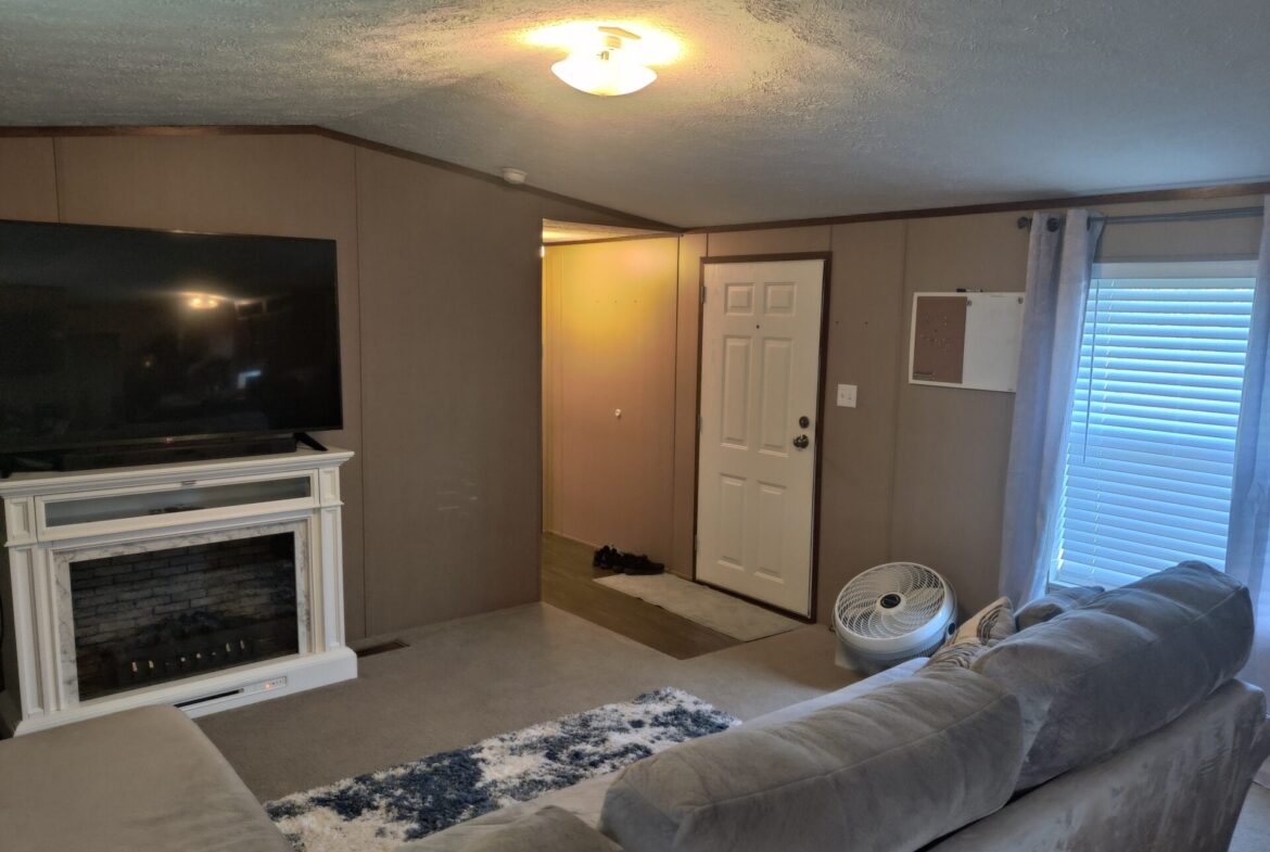 Living room of single wide manufactured home for sale in River's Edge, Clinton Township | Used Mobile Home for Sale Michigan