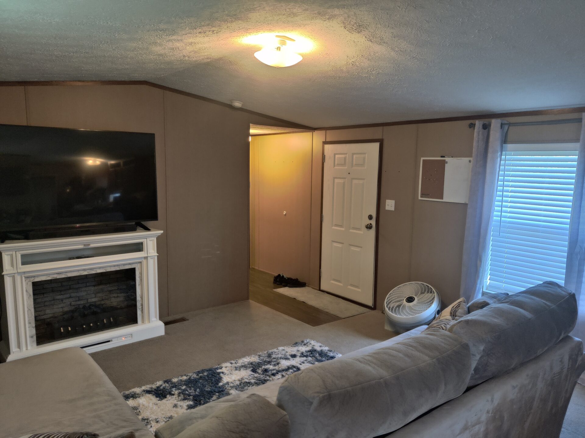 Living room of single wide manufactured home for sale in River's Edge, Clinton Township | Used Mobile Home for Sale Michigan