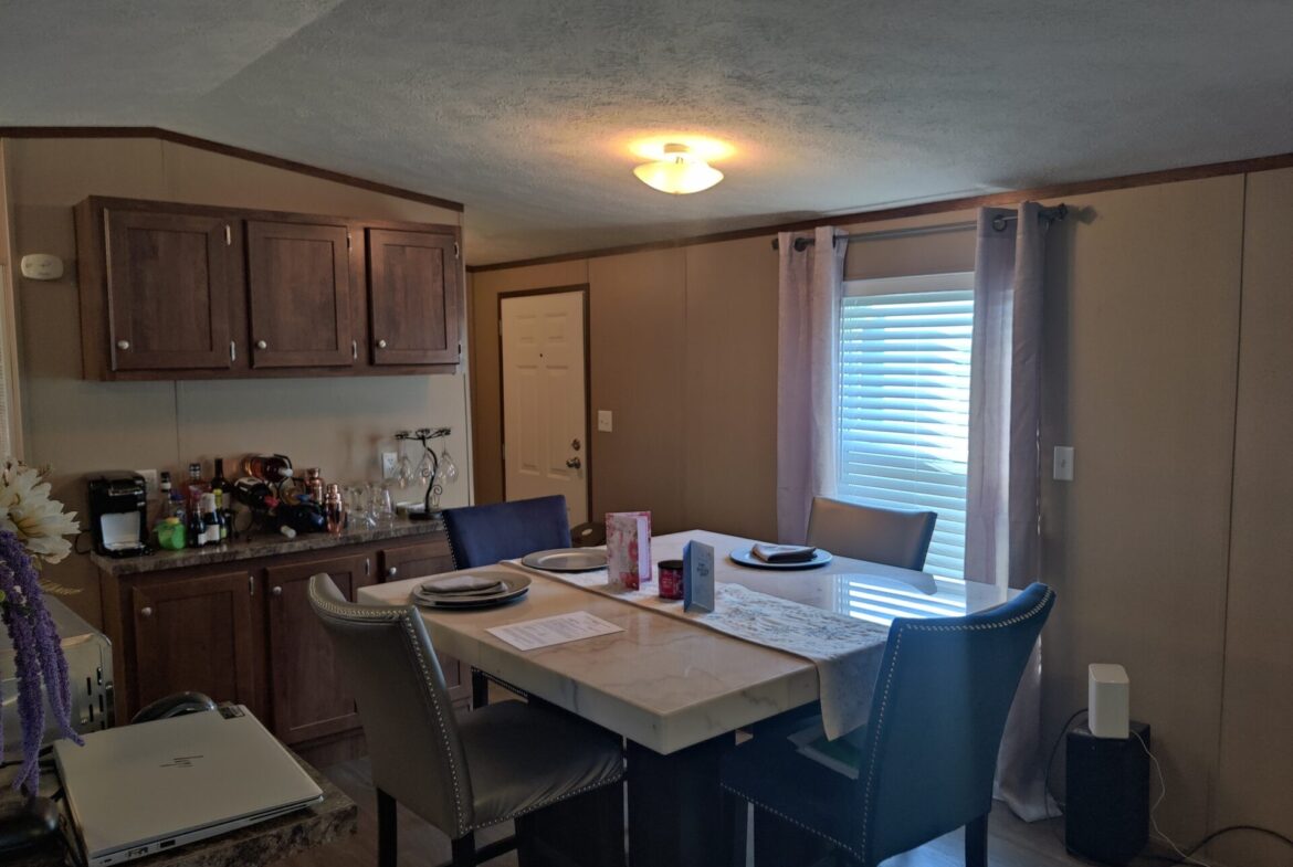 Dining room of single wide manufactured home for sale in River's Edge, Clinton Township | Used Mobile Home for Sale Michigan