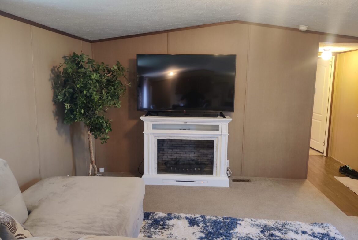 Living room of single wide manufactured home for sale in River's Edge, Clinton Township | Used Mobile Home for Sale Michigan